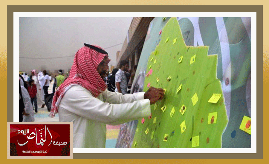 الفوتوغرافي عبدالله الشهري والمتطوعه أسماء الشهري في معرض حب الوطن